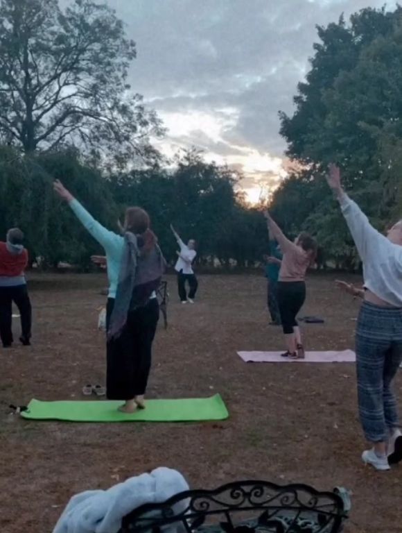 A lovely sunset Qigong session, a group of ladies following Hannah's instructions and mirroring her moves.