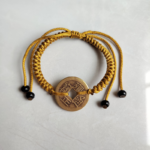 Five Emperor Coins Earth Yellow Cord Bracelet handmade with traditional Vajra Knot, adjustable Chinese Feng Shui jewelry for protection.