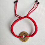 Five Emperor Coins Red Cord Bracelet handmade with traditional Vajra Knot, adjustable Chinese Feng Shui jewelry for protection.