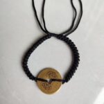 Five Emperor Coins Black Cord Bracelet handmade with traditional Vajra Knot, adjustable Chinese Feng Shui jewelry for protection.