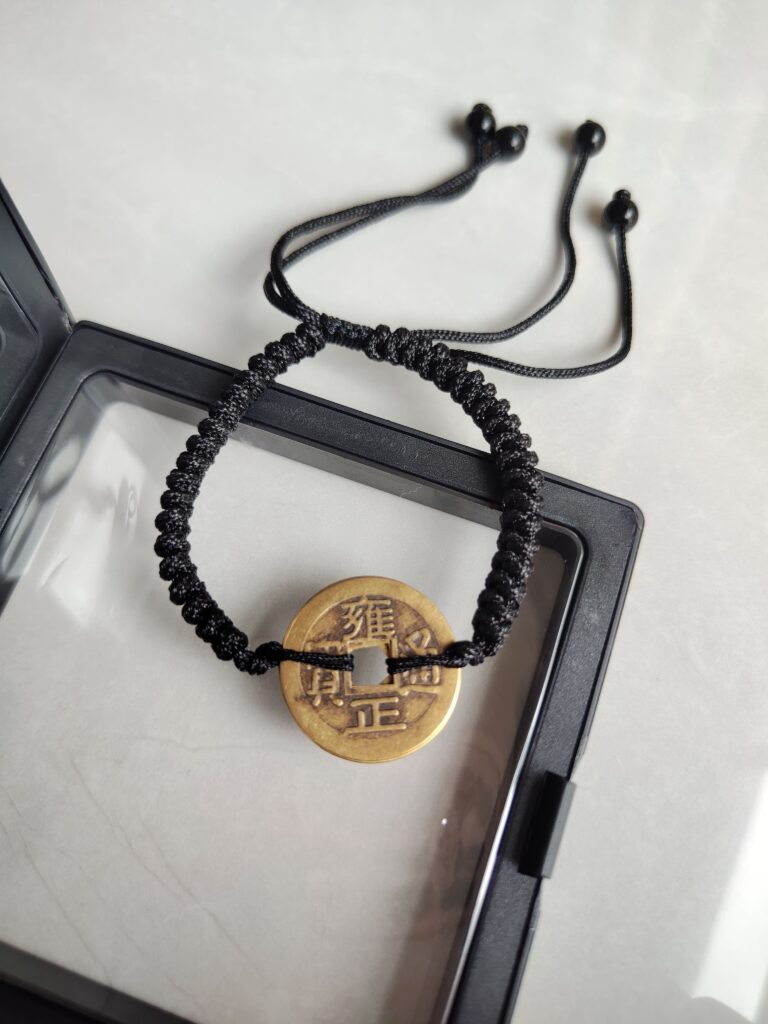 Five Emperor Coins Black Cord Bracelet handmade with traditional Vajra Knot, adjustable Chinese Feng Shui jewelry for protection.