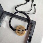 Five Emperor Coins Black Cord Bracelet handmade with traditional Vajra Knot, adjustable Chinese Feng Shui jewelry for protection.