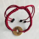 Five Emperor Coins Burgundy Cord Bracelet handmade with traditional Vajra Knot, adjustable Chinese Feng Shui jewelry for protection.