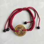 Five Emperor Coins Burgundy Cord Bracelet handmade with traditional Vajra Knot, adjustable Chinese Feng Shui jewelry for protection.