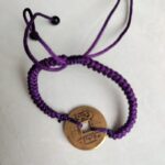 Five Emperor Coins Deep Purple Cord Bracelet handmade with traditional Vajra Knot, adjustable Chinese Feng Shui jewelry for protection.