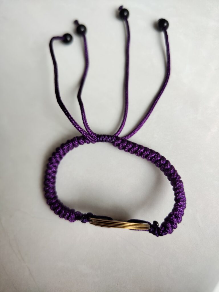 Five Emperor Coins Deep Purple Cord Bracelet handmade with traditional Vajra Knot, adjustable Chinese Feng Shui jewelry for protection.