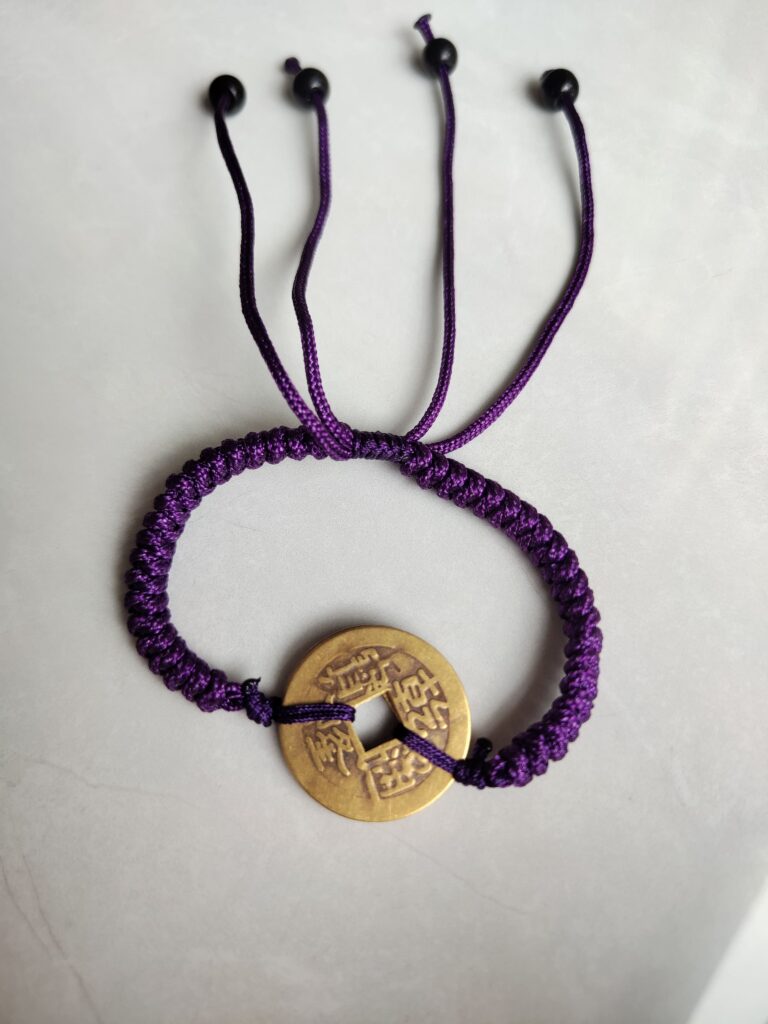 Five Emperor Coins Deep Purple Cord Bracelet handmade with traditional Vajra Knot, adjustable Chinese Feng Shui jewelry for protection.