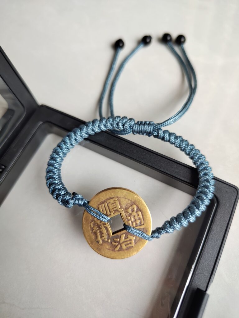 Five Emperor Coins Dusty Blue Cord Bracelet handmade with traditional Vajra Knot, adjustable Chinese Feng Shui jewelry for protection.