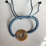 Five Emperor Coins Dusty Blue Cord Bracelet handmade with traditional Vajra Knot, adjustable Chinese Feng Shui jewelry for protection.