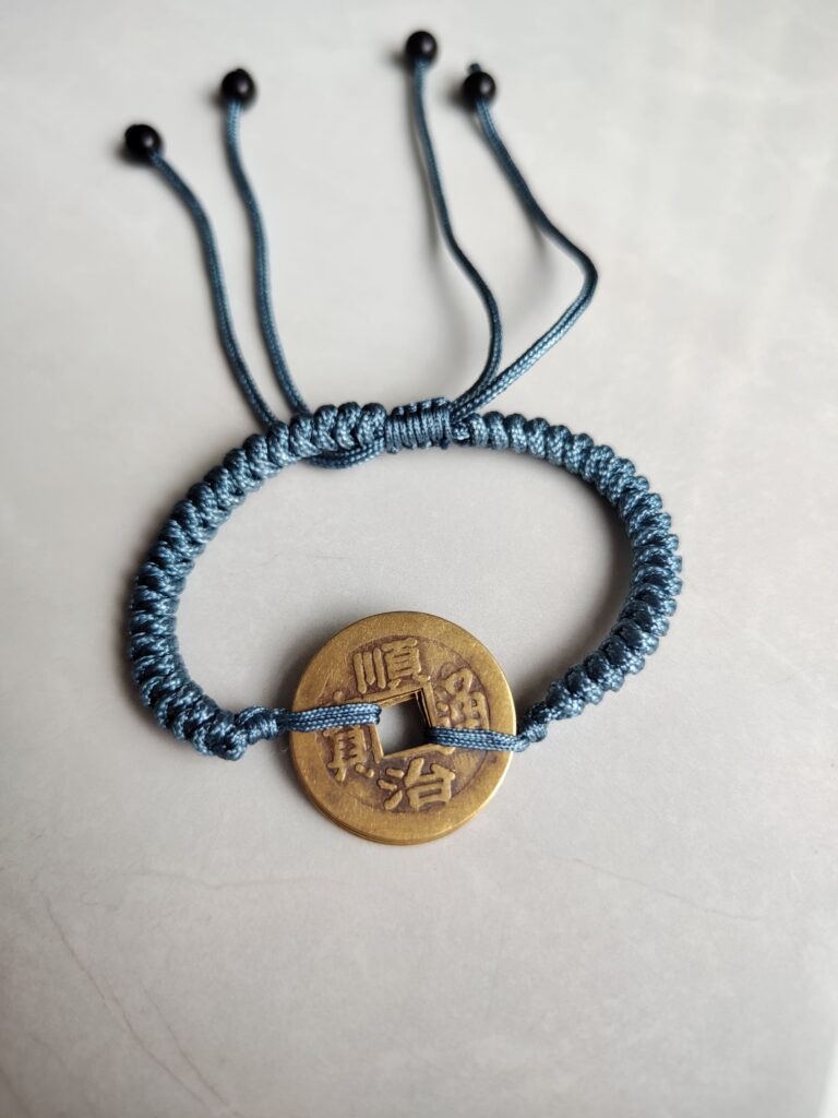 Five Emperor Coins Dusty Blue Cord Bracelet handmade with traditional Vajra Knot, adjustable Chinese Feng Shui jewelry for protection.