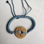 Five Emperor Coins Dusty Blue Cord Bracelet handmade with traditional Vajra Knot, adjustable Chinese Feng Shui jewelry for protection.