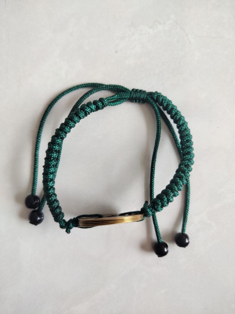Five Emperor Coins Forest Green Cord Bracelet handmade with traditional Vajra Knot, adjustable Chinese Feng Shui jewelry for protection.