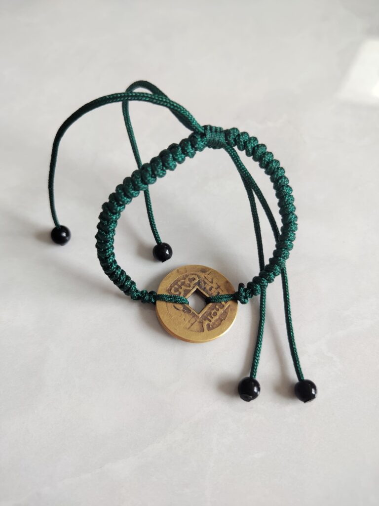 Five Emperor Coins Forest Green Cord Bracelet handmade with traditional Vajra Knot, adjustable Chinese Feng Shui jewelry for protection.