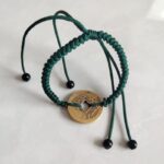 Five Emperor Coins Forest Green Cord Bracelet handmade with traditional Vajra Knot, adjustable Chinese Feng Shui jewelry for protection.