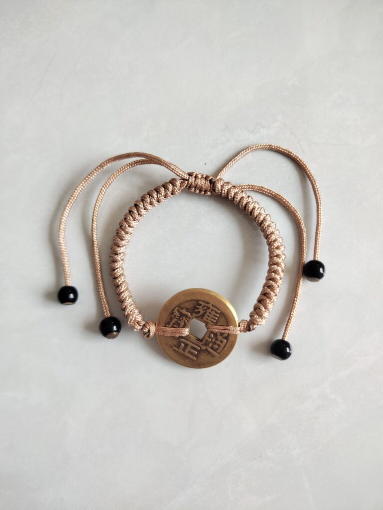 Five Emperor Coins Khaki Cord Bracelet handmade with traditional Vajra Knot, adjustable Chinese Feng Shui jewelry for protection.