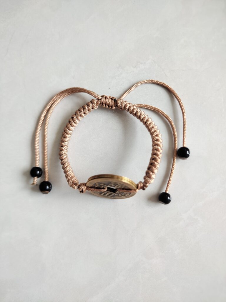 Five Emperor Coins Khaki Cord Bracelet handmade with traditional Vajra Knot, adjustable Chinese Feng Shui jewelry for protection.