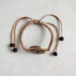 Five Emperor Coins Khaki Cord Bracelet handmade with traditional Vajra Knot, adjustable Chinese Feng Shui jewelry for protection.