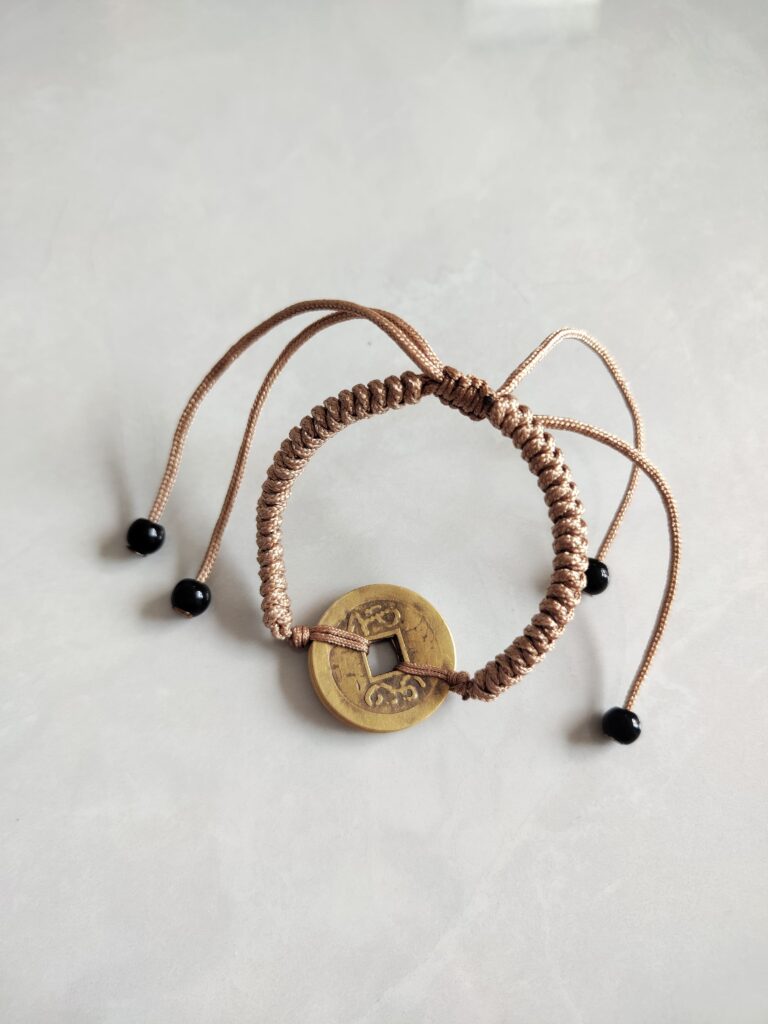 Five Emperor Coins Khaki Cord Bracelet handmade with traditional Vajra Knot, adjustable Chinese Feng Shui jewelry for protection.