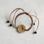 Five Emperor Coins Khaki Cord Bracelet handmade with traditional Vajra Knot, adjustable Chinese Feng Shui jewelry for protection.