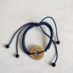 Five Emperor Coins Navy Blue Cord Bracelet handmade with traditional Vajra Knot, adjustable Chinese Feng Shui jewelry for protection.