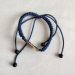 Five Emperor Coins Navy Blue Cord Bracelet handmade with traditional Vajra Knot, adjustable Chinese Feng Shui jewelry for protection.