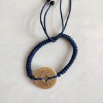 Five Emperor Coins Navy Blue Cord Bracelet handmade with traditional Vajra Knot, adjustable Chinese Feng Shui jewelry for protection.