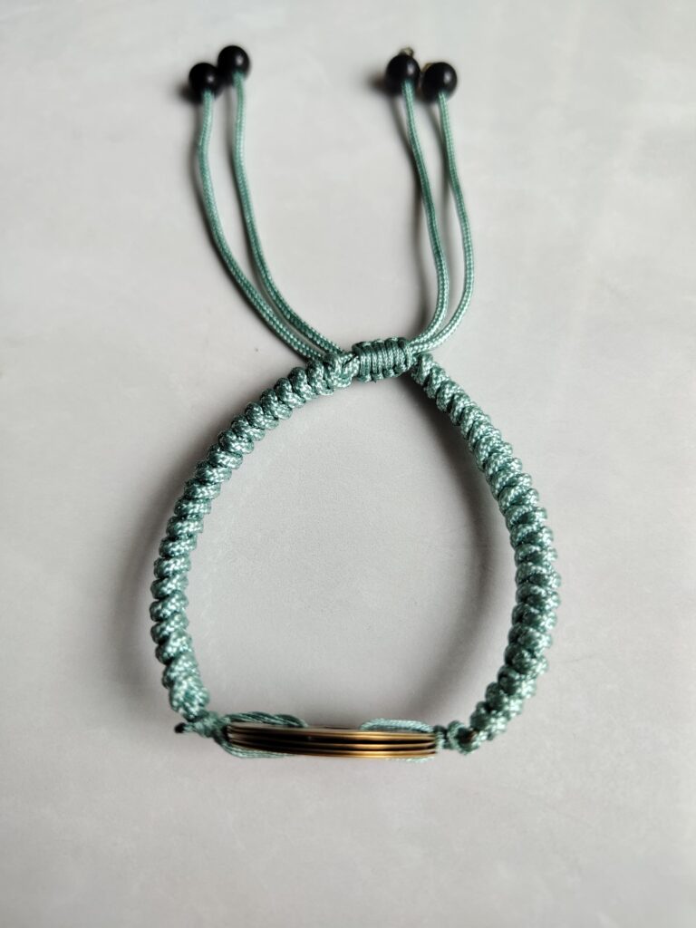 Five Emperor Coins Olive Green Cord Bracelet handmade with traditional Vajra Knot, adjustable Chinese Feng Shui jewelry for protection.
