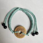 Five Emperor Coins Olive Green Cord Bracelet handmade with traditional Vajra Knot, adjustable Chinese Feng Shui jewelry for protection.
