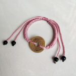 Five Emperor Coins Peach Pink Cord Bracelet handmade with traditional Vajra Knot, adjustable Chinese Feng Shui jewelry for protection.