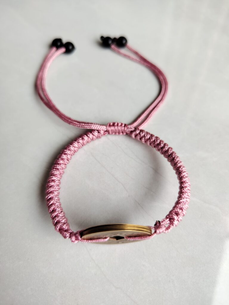 Five Emperor Coins Peach Pink Cord Bracelet handmade with traditional Vajra Knot, adjustable Chinese Feng Shui jewelry for protection.