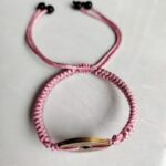Five Emperor Coins Peach Pink Cord Bracelet handmade with traditional Vajra Knot, adjustable Chinese Feng Shui jewelry for protection.
