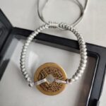 Five Emperor Coins Silver Grey Cord Bracelet handmade with traditional Vajra Knot, adjustable Chinese Feng Shui jewelry for protection.
