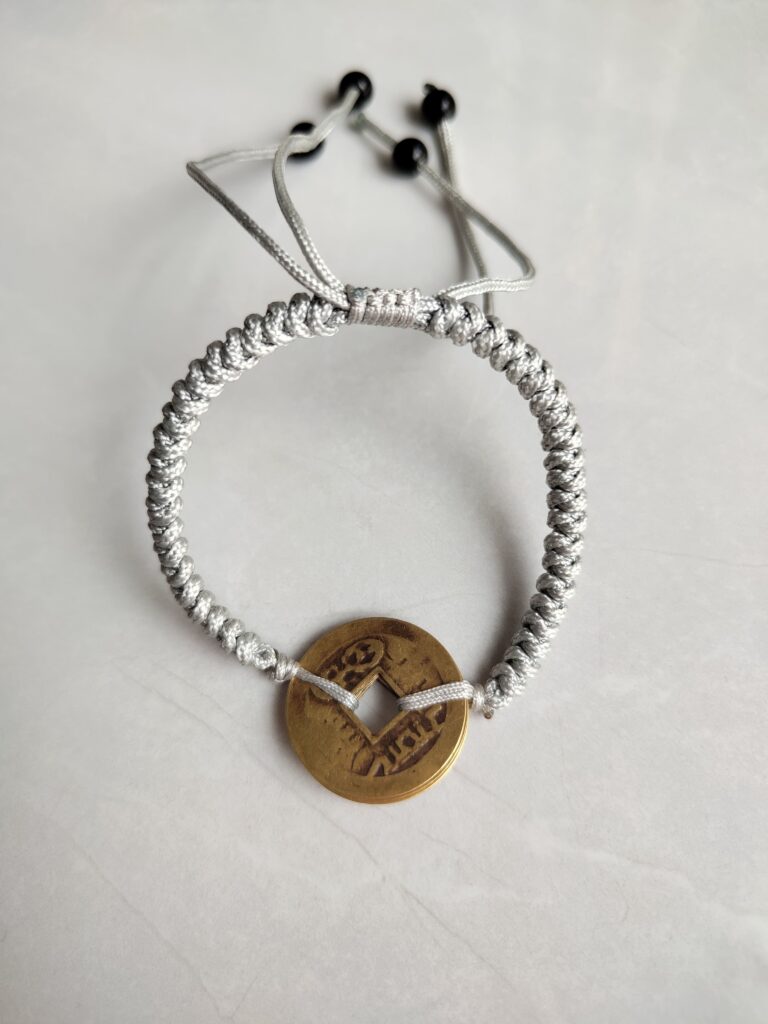 Five Emperor Coins Silver Grey Cord Bracelet handmade with traditional Vajra Knot, adjustable Chinese Feng Shui jewelry for protection.