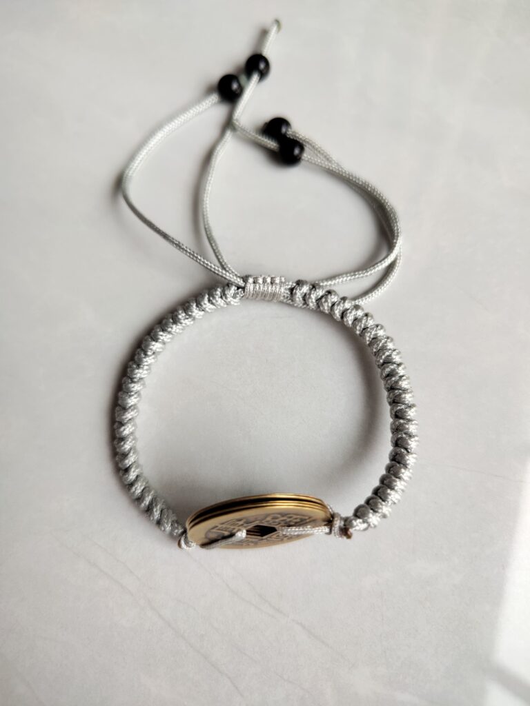 Five Emperor Coins Silver Grey Cord Bracelet handmade with traditional Vajra Knot, adjustable Chinese Feng Shui jewelry for protection.
