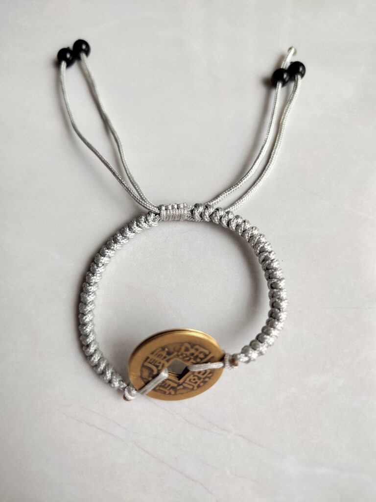 Five Emperor Coins Silver Grey Cord Bracelet handmade with traditional Vajra Knot, adjustable Chinese Feng Shui jewelry for protection.